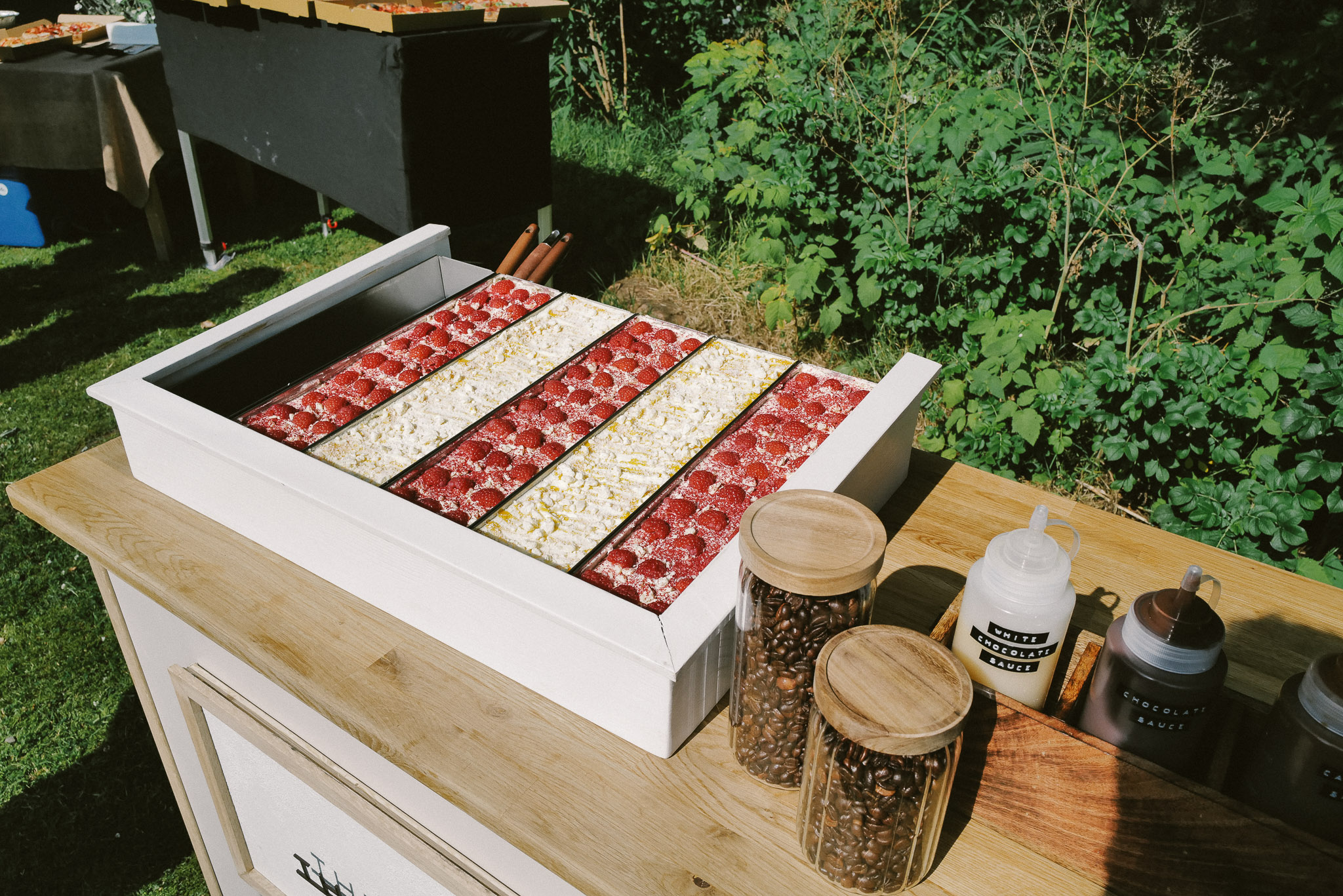 Long trays of tiramisu on the cart, ready to serve
