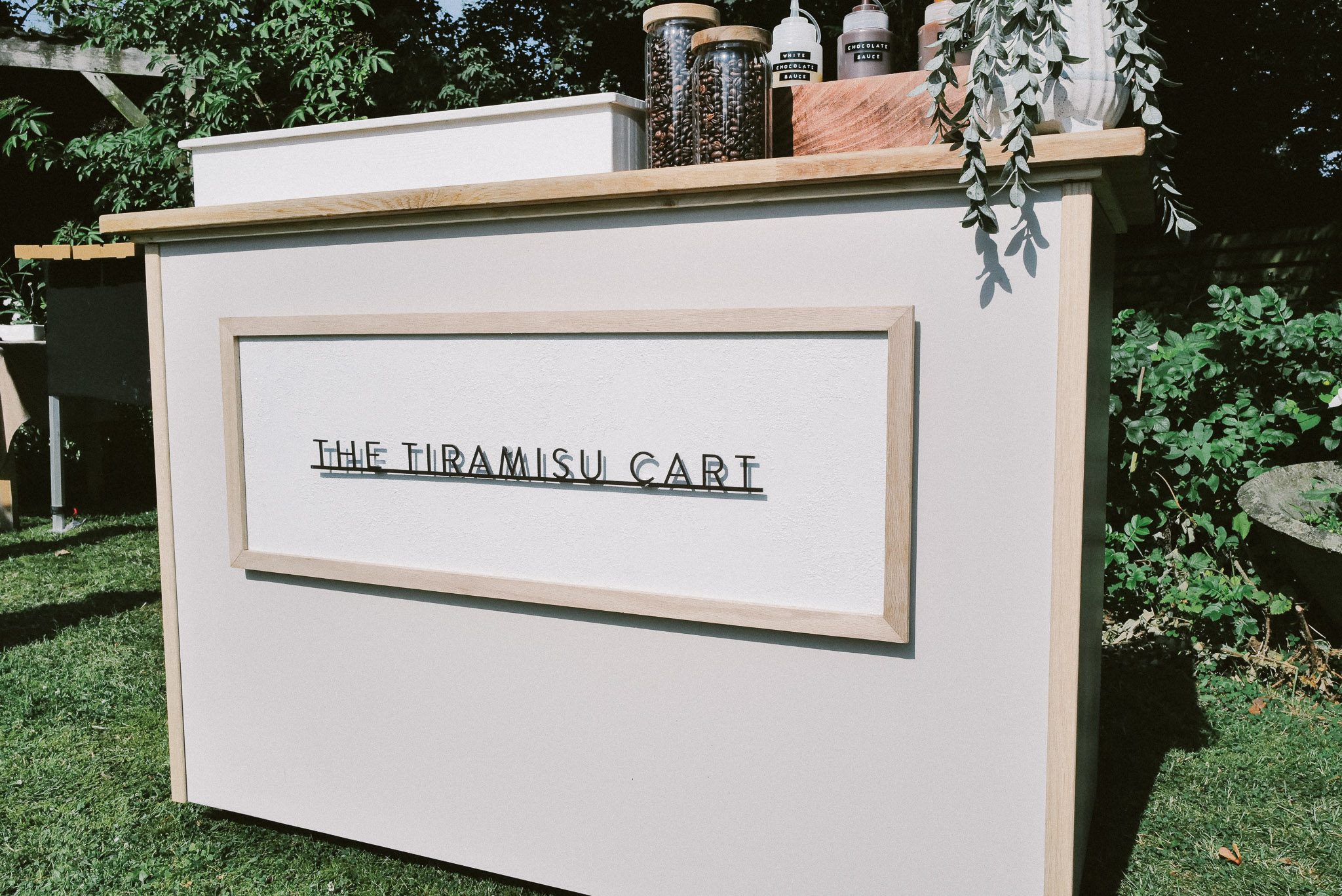 The white Tiramisu Cart set up outside