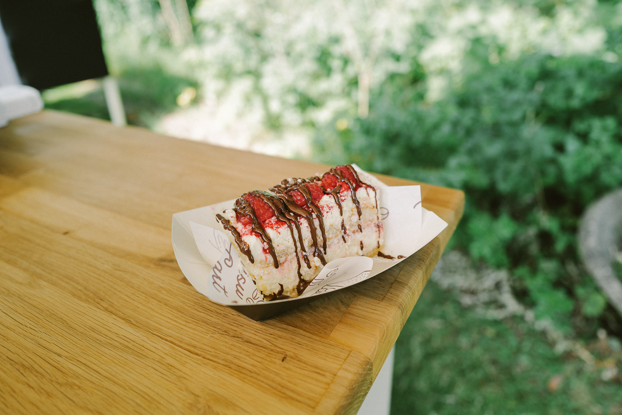 A slice of tiramisu finished with a sauce of the guest’s choice